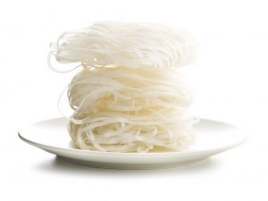 Dried rice noodles isolated on white background.